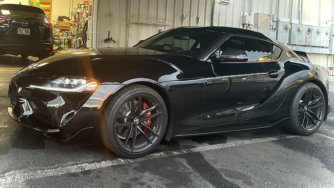 Glossy black Toyota Supra freshly detailed in the SilvaShine bay in Kailua-Kona